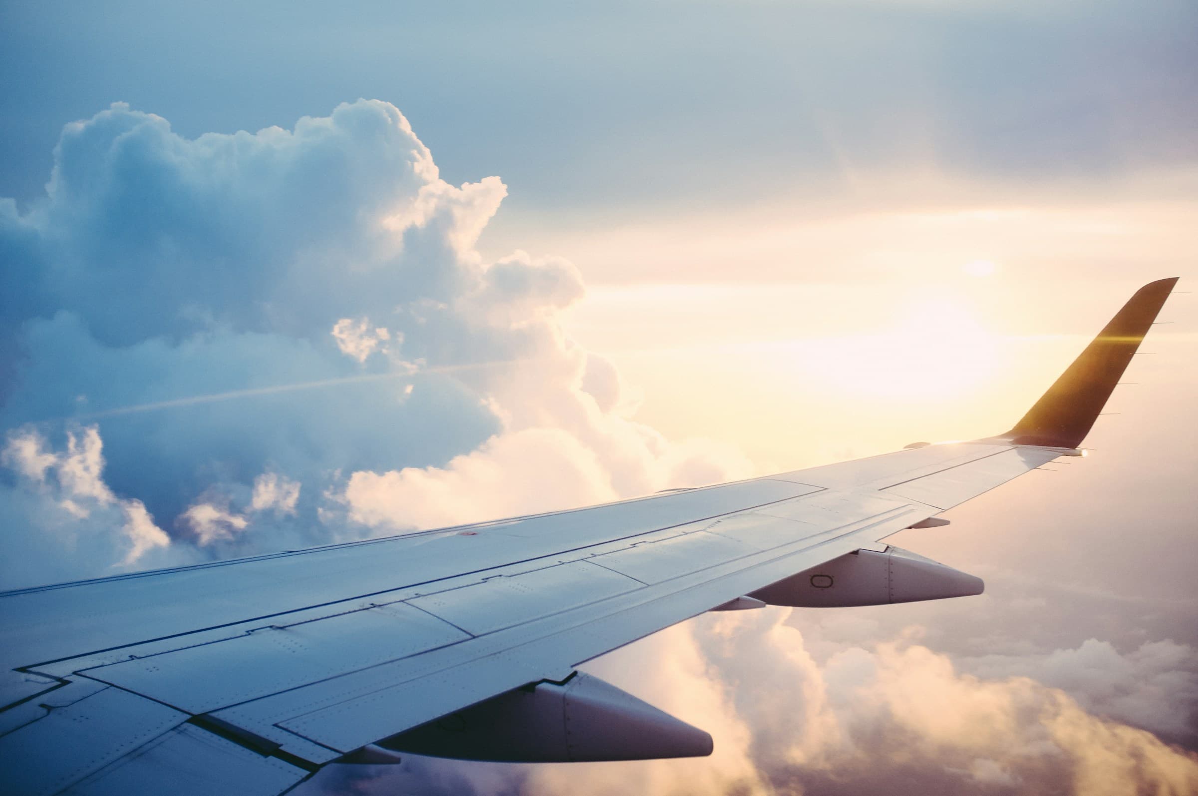 View over an aircraft wing above the clouds